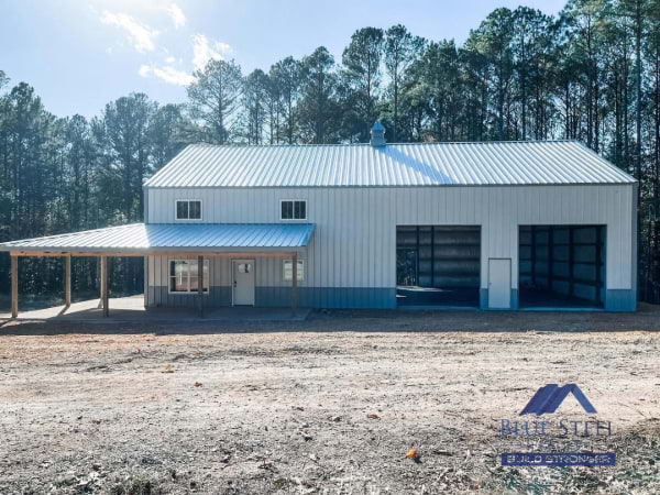 barndominium with garage with a covered porch area and two garage spaces