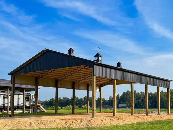 Large Black metal open RV Garage or pull in with metal tresses