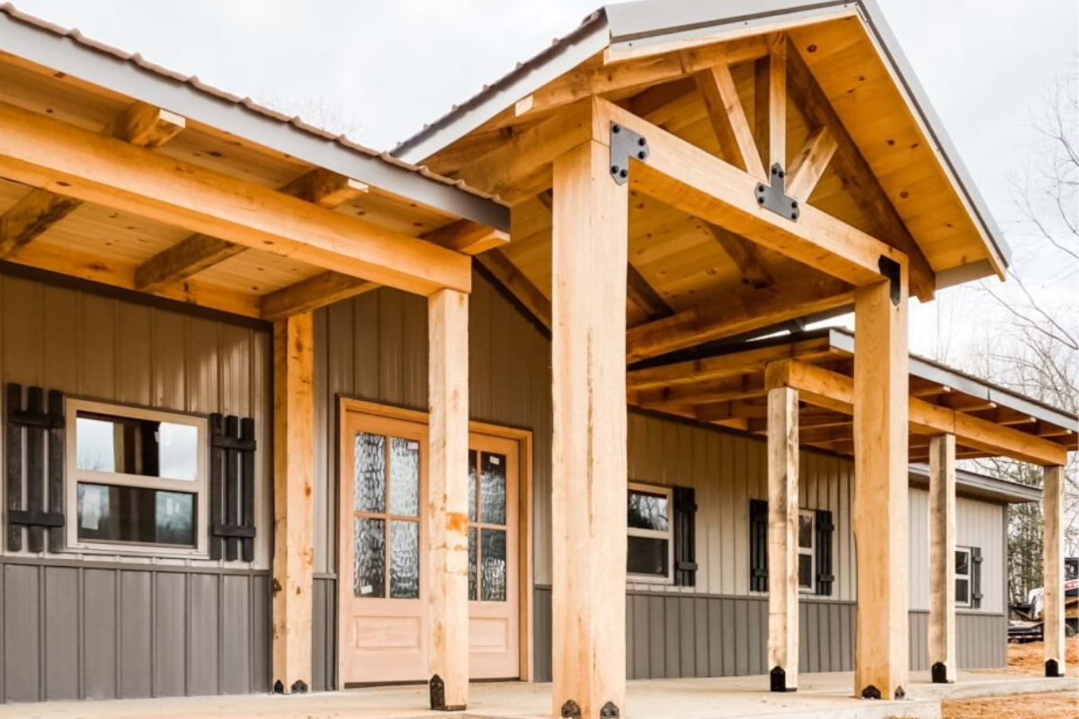 Blue Steel Manufacturing post frame shop house with wood porch trusses