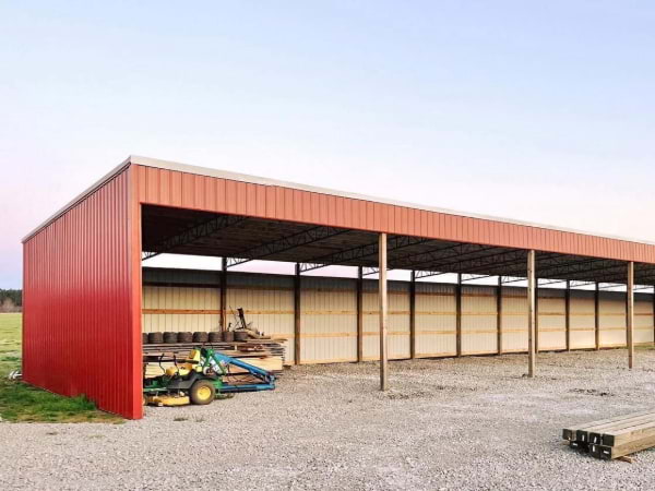 Red one side open garage or storage area for farm or ag purposes