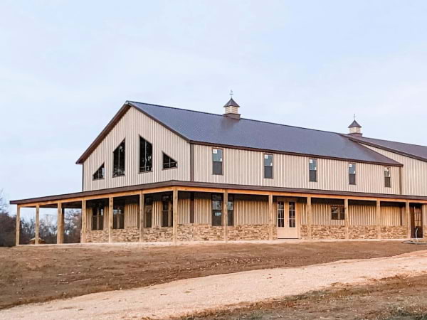 Shop home with tan siding and brown roof